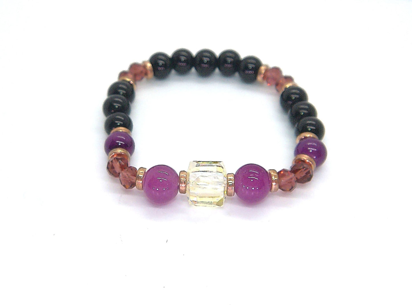 Go To: https://www.artistryjewelry.net/products/amethyst-and-black-garnet-yoga-bracelet