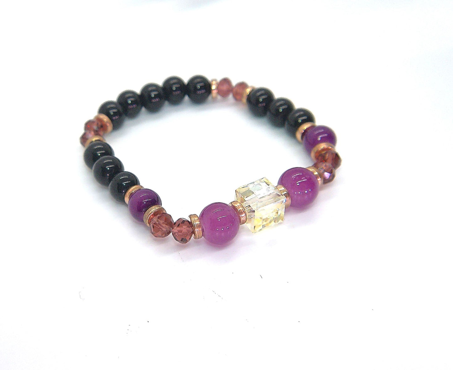 Go To: https://www.artistryjewelry.net/products/amethyst-and-black-garnet-yoga-bracelet