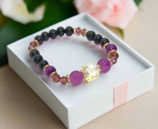 Go To: https://www.artistryjewelry.net/products/amethyst-and-black-garnet-yoga-bracelet