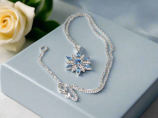 https://www.artistryjewelry.net/products/lovely-blue-winter-snowflake-necklace