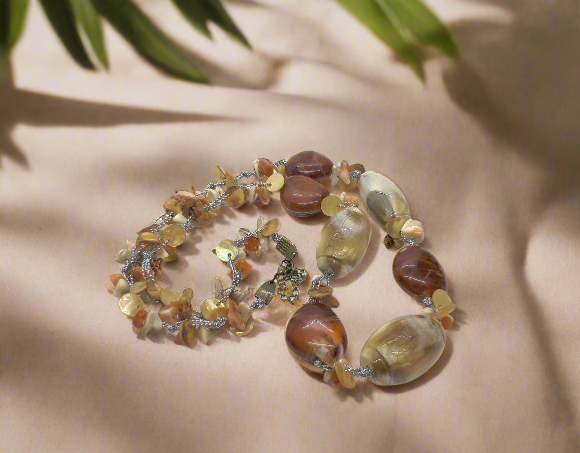 https://www.artistryjewelry.net/products/shells-galore-necklace