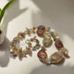 https://www.artistryjewelry.net/products/shells-galore-necklace