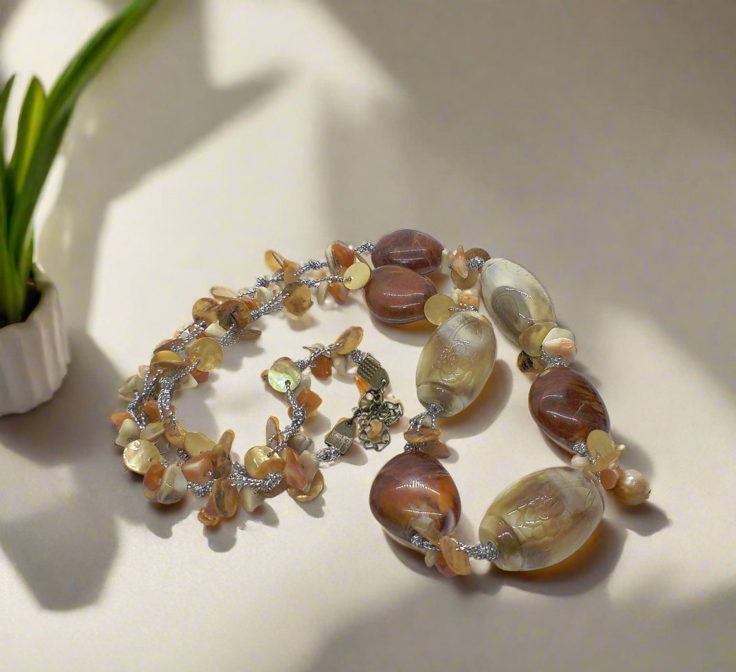 https://www.artistryjewelry.net/products/shells-galore-necklace