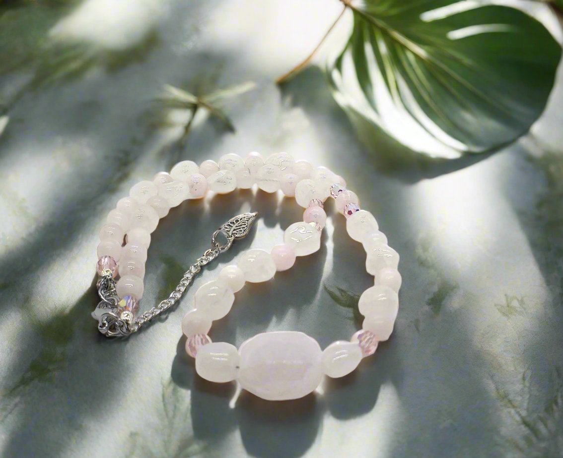 https://www.artistryjewelry.net/products/stunning-rose-pink-quartz-and-crystals-semi-precious-beaded-necklace-handcrafted-by-artistry-jewelry