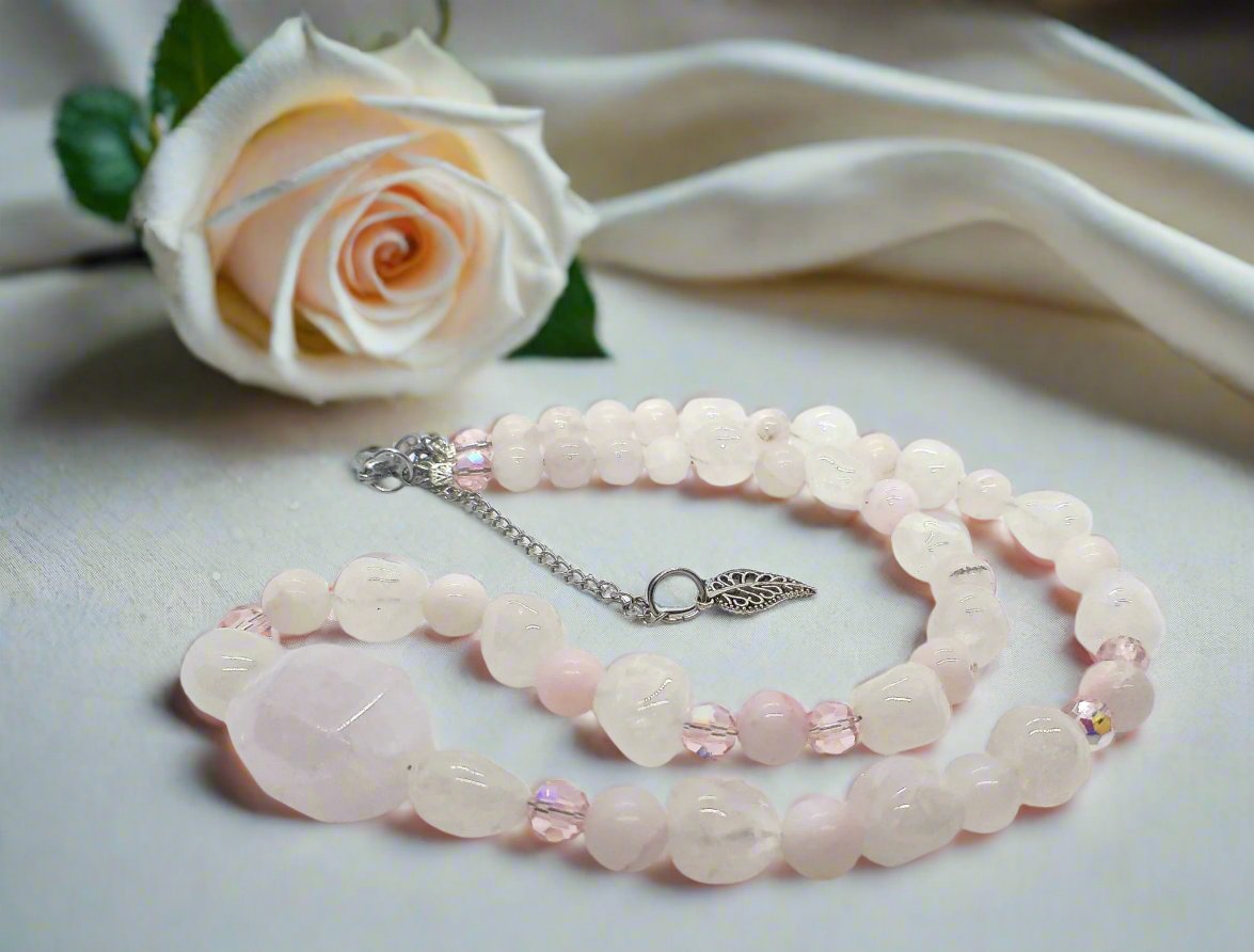 https://www.artistryjewelry.net/products/stunning-rose-pink-quartz-and-crystals-semi-precious-beaded-necklace-handcrafted-by-artistry-jewelry