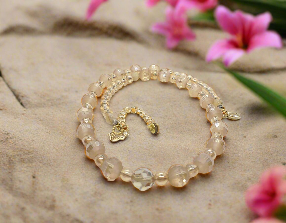 https://www.artistryjewelry.net/products/beautiful-peach-amber-crystal-and-cream-golden-shadow-beaded-necklace-set-handcrafted-by-artistry-jewelry