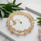 https://www.artistryjewelry.net/products/beautiful-peach-amber-crystal-and-cream-golden-shadow-beaded-necklace-set-handcrafted-by-artistry-jewelry