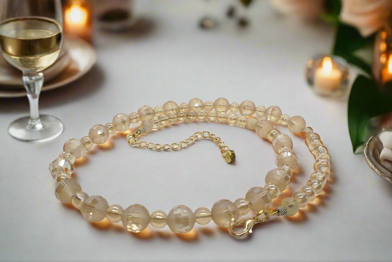 https://www.artistryjewelry.net/products/beautiful-peach-amber-crystal-and-cream-golden-shadow-beaded-necklace-set-handcrafted-by-artistry-jewelry