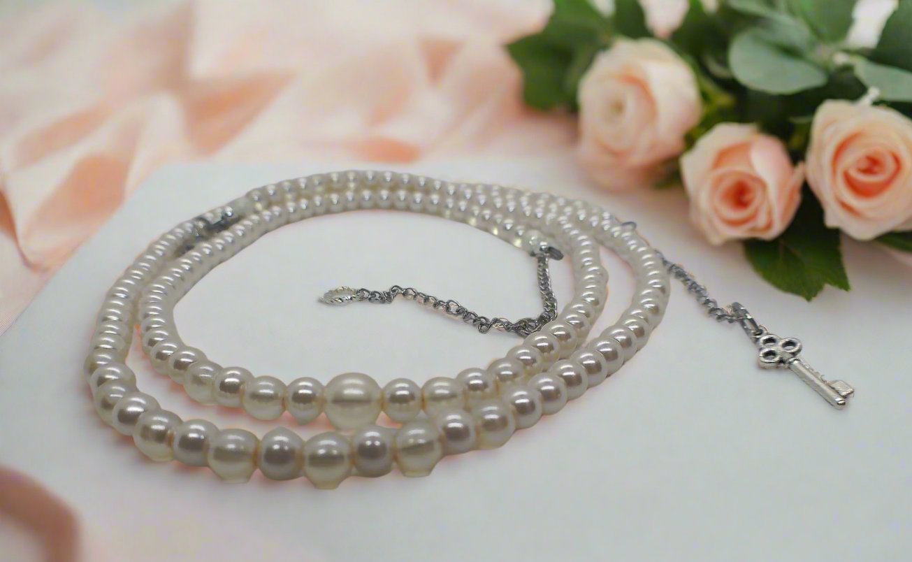 https://www.artistryjewelry.net/products/beautiful-light-peach-stardust-and-pearl-two-strand-beaded-necklace-handcrafted-by-artistry-jewelry