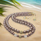 https://www.artistryjewelry.net/products/stunning-crystal-pearl-and-druk-two-strand-beaded-necklace