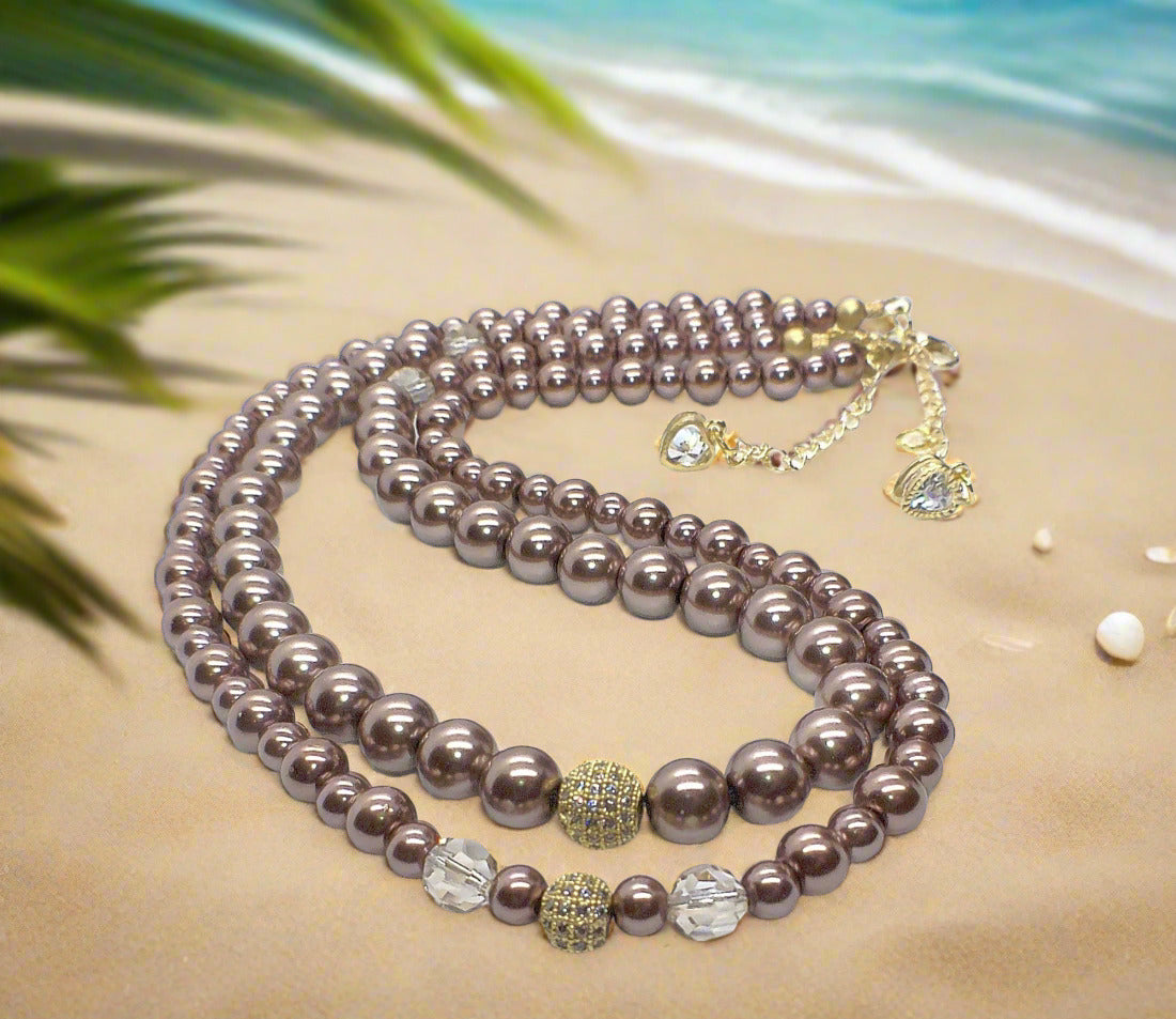 https://www.artistryjewelry.net/products/stunning-crystal-pearl-and-druk-two-strand-beaded-necklace