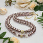 https://www.artistryjewelry.net/products/stunning-crystal-pearl-and-druk-two-strand-beaded-necklace