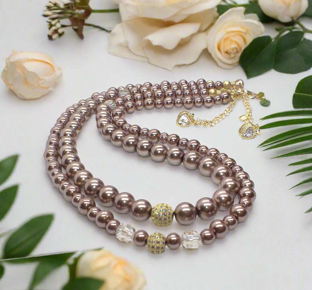 https://www.artistryjewelry.net/products/stunning-crystal-pearl-and-druk-two-strand-beaded-necklace