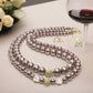 https://www.artistryjewelry.net/products/stunning-crystal-pearl-and-druk-two-strand-beaded-necklace