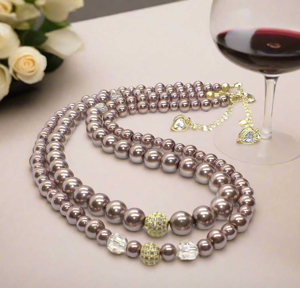 https://www.artistryjewelry.net/products/stunning-crystal-pearl-and-druk-two-strand-beaded-necklace