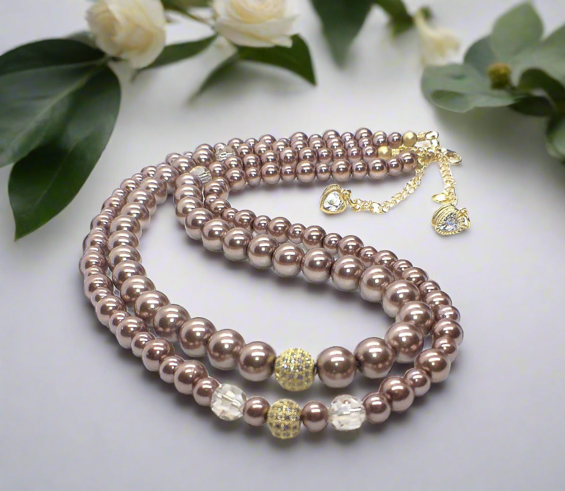 https://www.artistryjewelry.net/products/stunning-crystal-pearl-and-druk-two-strand-beaded-necklace