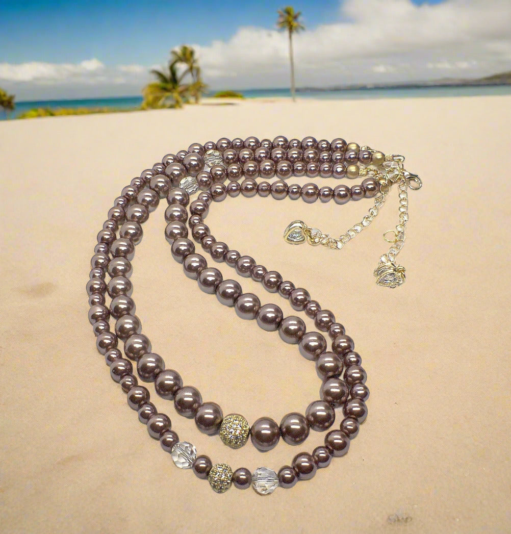 https://www.artistryjewelry.net/products/stunning-crystal-pearl-and-druk-two-strand-beaded-necklace