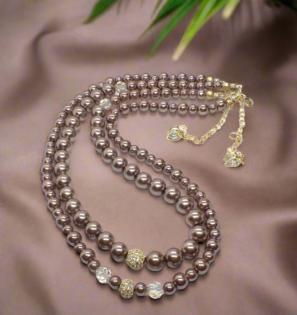 https://www.artistryjewelry.net/products/stunning-crystal-pearl-and-druk-two-strand-beaded-necklace