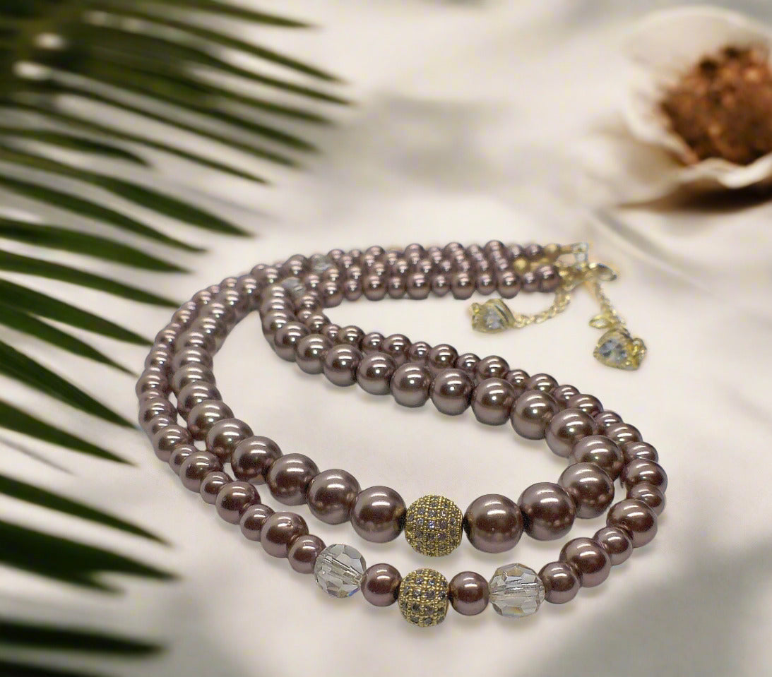 https://www.artistryjewelry.net/products/stunning-crystal-pearl-and-druk-two-strand-beaded-necklace