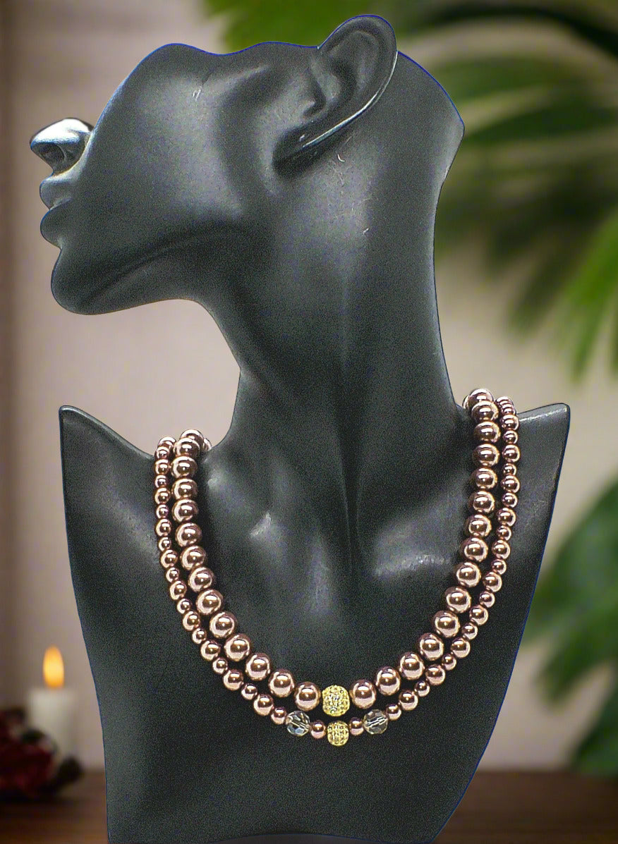 https://www.artistryjewelry.net/products/stunning-crystal-pearl-and-druk-two-strand-beaded-necklace