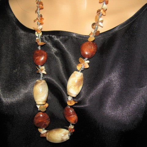 https://www.artistryjewelry.net/products/shells-galore-necklace