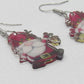 https://www.artistryjewelry.net/products/happy-santa-earrings